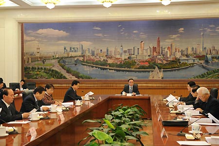 Wu Bangguo (C), Chairman of the Standing Committee of China's National People's Congress (NPC), presides over the 15th meeting of the chairman and vice-chairpersons of the 11th NPC Standing Committee, in Beijing, capital of China, Dec. 15, 2008. 