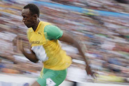  Jamaica's Usain Bolt competes during the men's 200m semifinal of the 2009 IAAF Athletics World Championships in Berlin, Germany, Aug. 19, 2009. Bolt clocked 20.08 seconds and was qualified for the final. (Xinhua/Liao Yujie