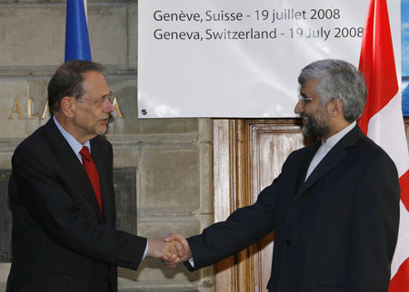 E.U. foreign policy chief Javier Solana (L) shakes hand with Iran's chief nuclear negotiator Saeed Jalili before a meeting on nuclear issues at the Town Hall in Geneva July 19, 2008. 