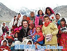 Greg Mortenson poses with schoolchildren in Afghanistan. Greg Mortenson poses with schoolchildren in Afghanistan.