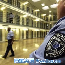 Guards patrol a cellblock at the Cummins Unit of the Arkansas Department of Correction in 2009