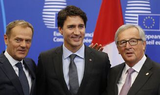 国际英语新闻:EU, Canada sign landmark free trade deal after Belgian drama