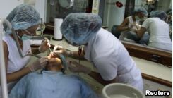 VOA慢速英语:Many Americans Travel to Other Countries for Medical Care